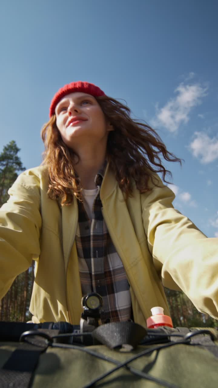 Woman cycling in the forest