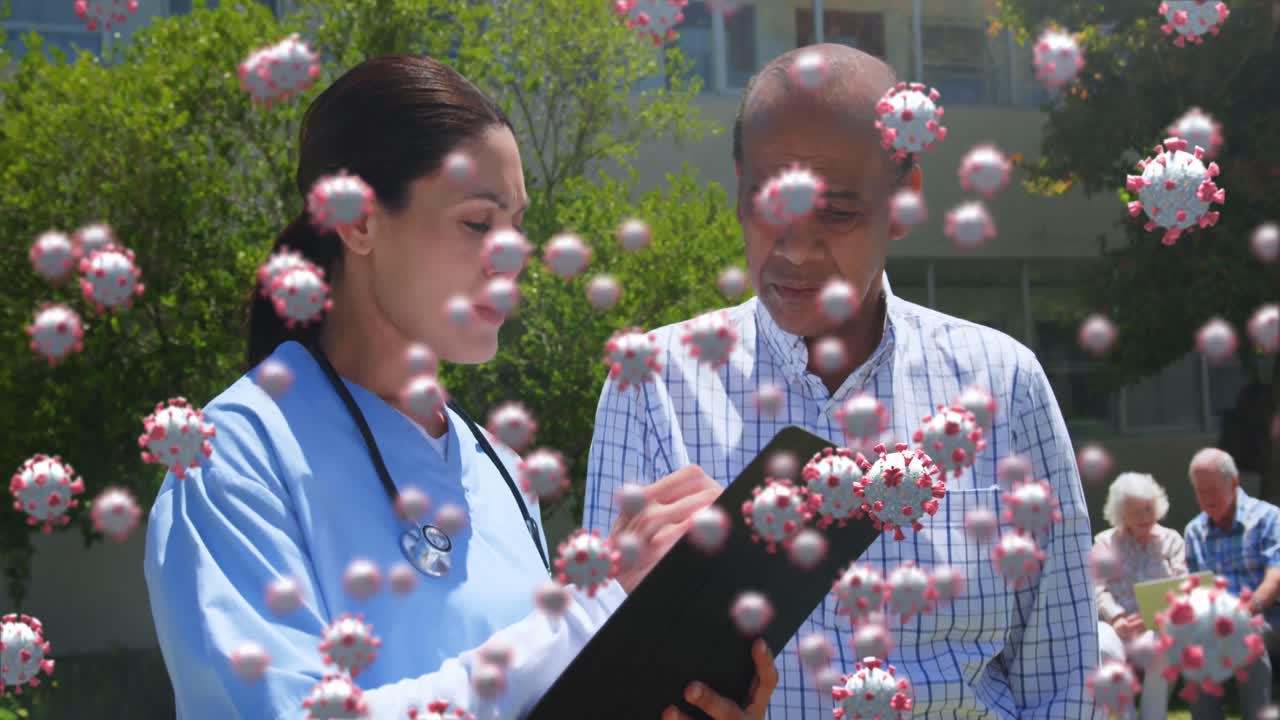 Covid-19 cells against female doctor and senior man discussing over clipboard