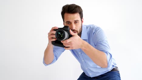 Photographer-taking-photo-with-professional-digital-camera