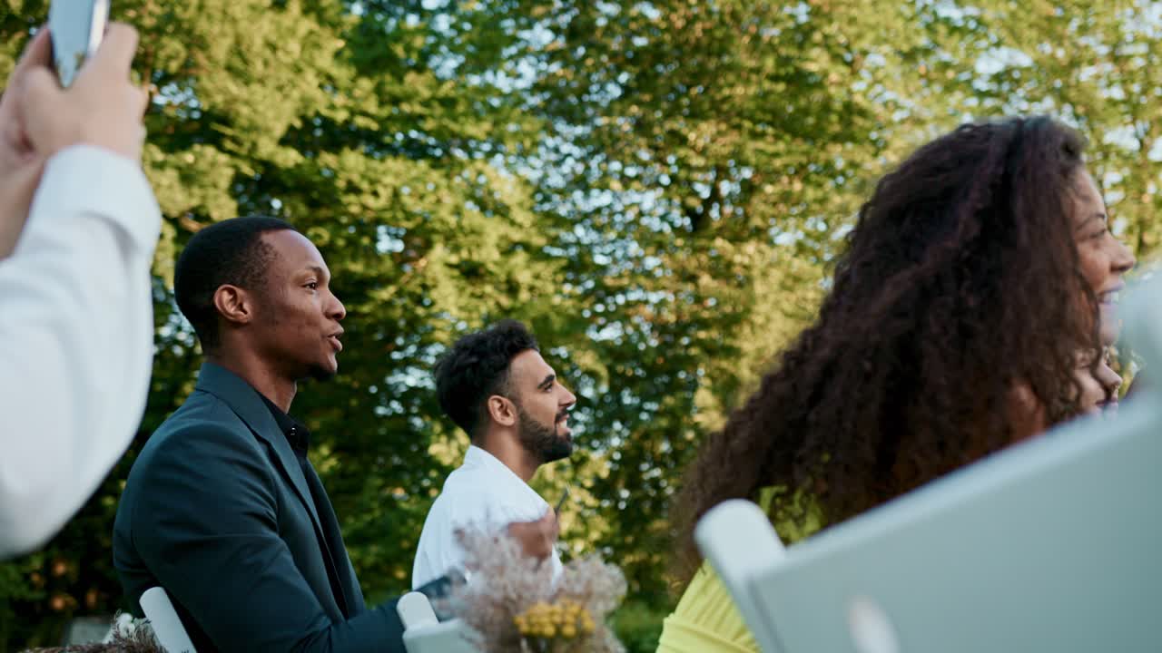 Wedding guests at an outdoor celebration