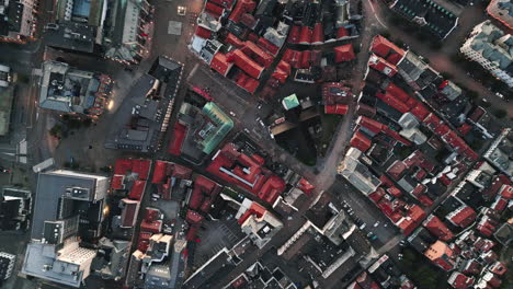 top fixed and slowly descending aerial view over colorful rooftops of bergen, norway