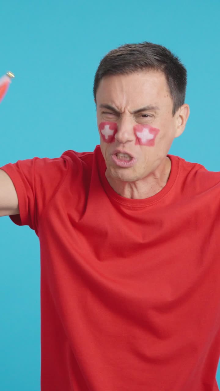 Man Cheering for Switzerland, angry with the decision of referee