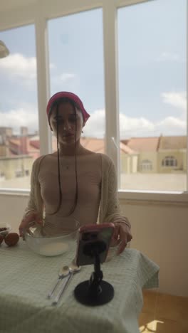 young person baking or cooking at kitchen table