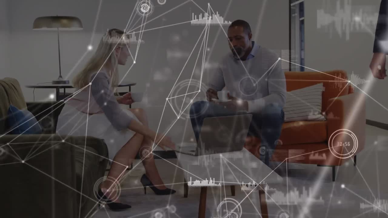 Dots and graphs connecting with lines over diverse coworkers with laptop and coffee shaking hands