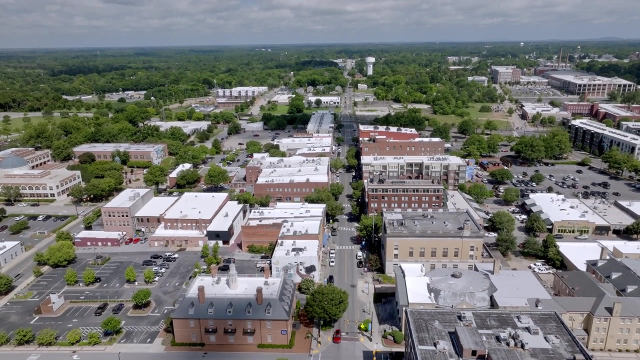 Downtown Rock Hill, South Carolina with drone video moving up.