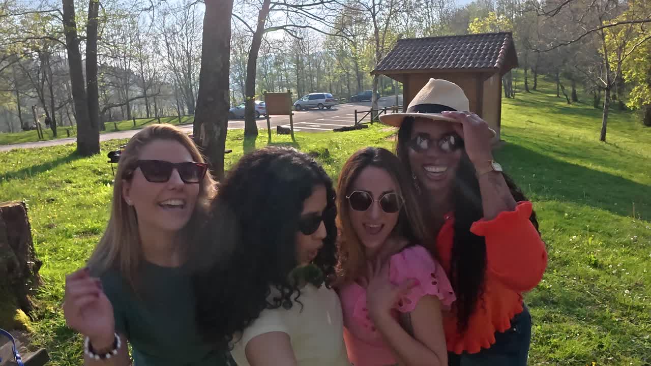 A group of friends taking a selfie in the park