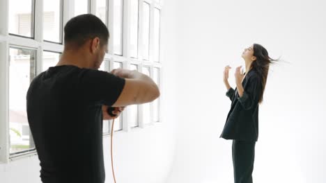 fashion shoot in a studio with model and photographer