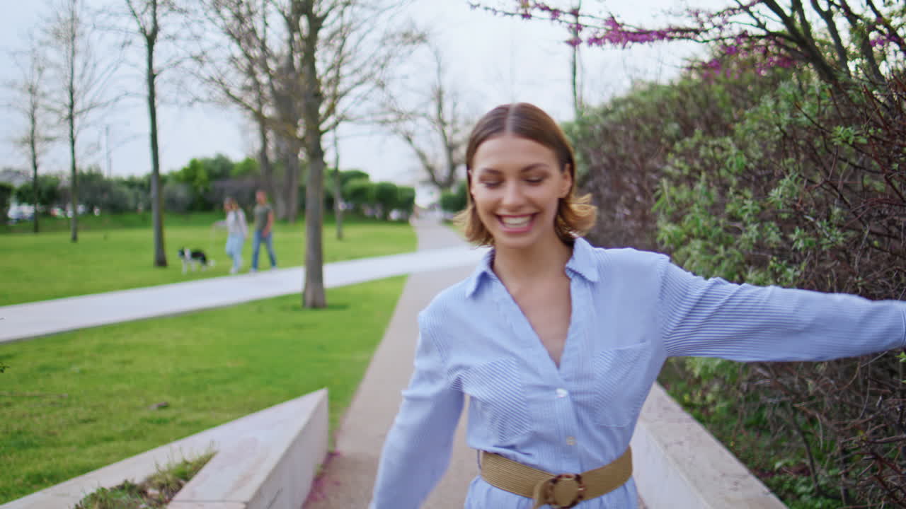 Happy model walking park smiling brightly closeup. Cheerful woman enjoy stroll