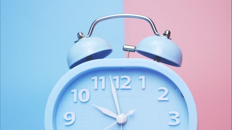 time lapse blue alarm clock tell the time 10 o'clock.