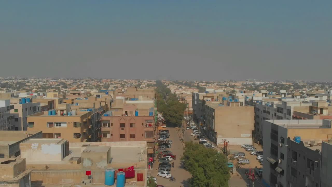 Aerial Dolly Left Across Rooftops Over Clifton Cantonment In Karachi, Pakistan