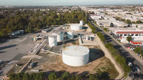 the-inner-workings-of-an-industrial-park-with-its-towering-oil-tanks,-intricate-pipes,-and-massive-silos-in-this-captivating-drone-time-lapse,-showcasing-storage-and-distribution-facilities