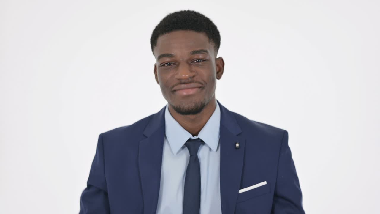 African Businessman Showing Okay Sign on White Background