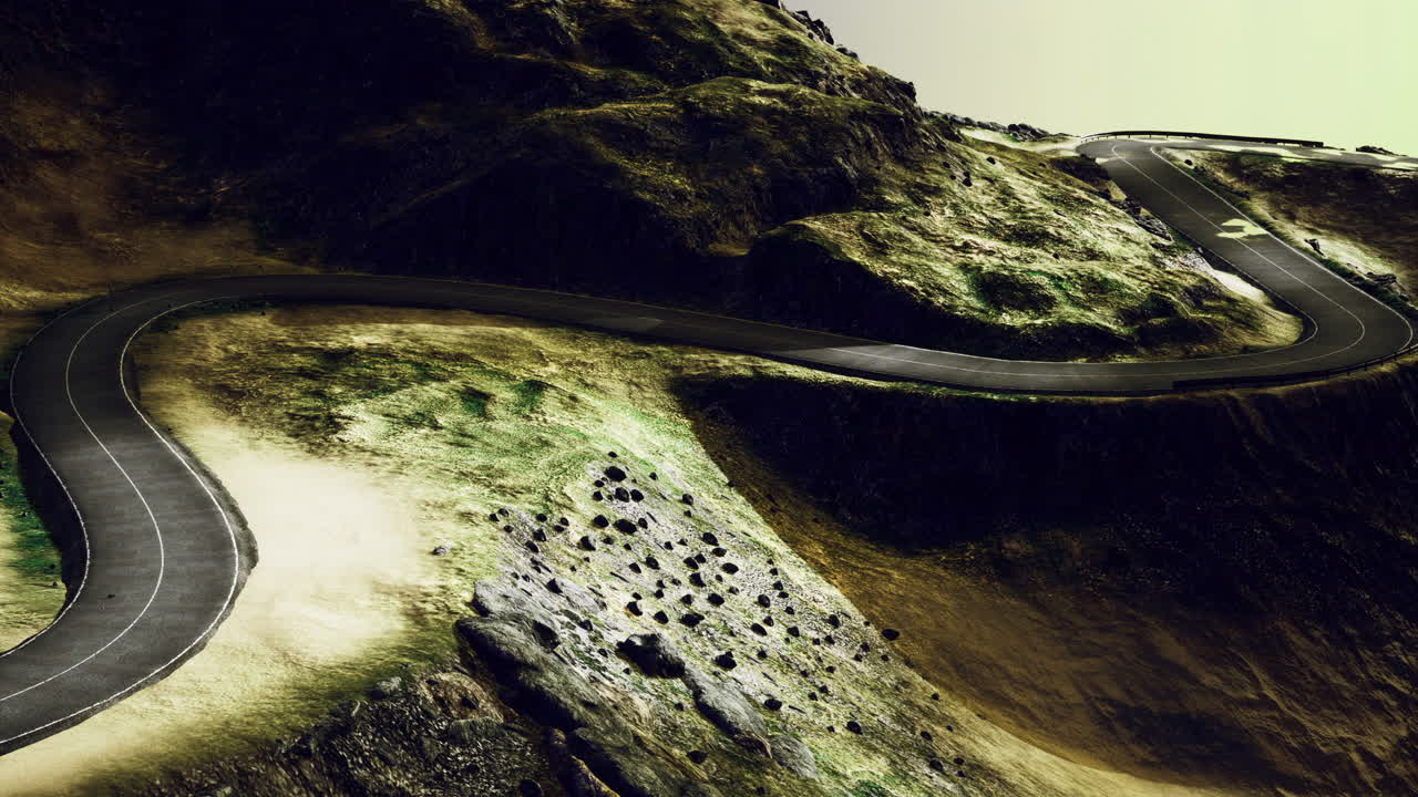 Winding road through rocky terrain under a dramatic sky at dusk