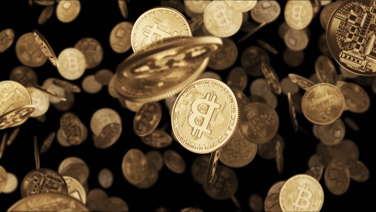 떨어지는 금 동전 비트코인