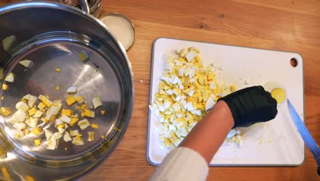 chopping boiled eggs for salad