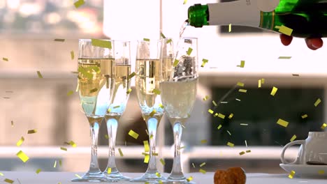 Animation-of-gold-confetti-falling-and-bottle-being-poured-into-four-glasses-of-champagne