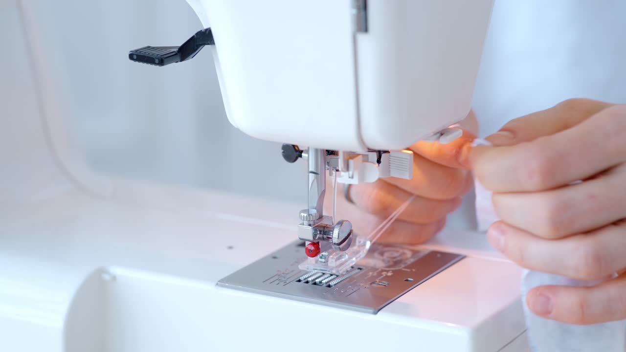 Person using a sewing machine