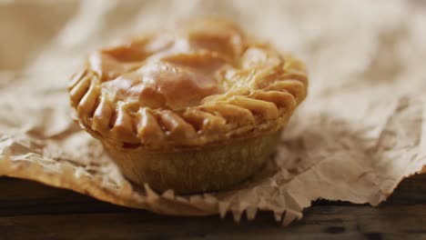 video of pie seen from above on wooden background