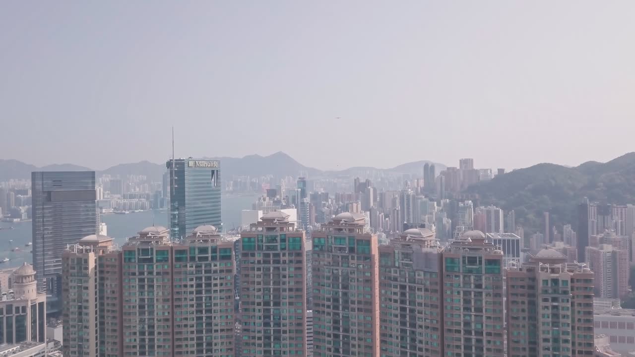 Residential buildings and skyscrapers in Happy Valley, Hong Kong. Aerial drone view