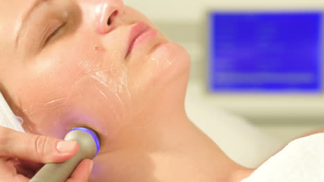 woman taking lifting treatment at beauty spa