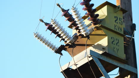 Closeup-telephoto-view-of-transformer-on-electricity-pole,-electricity-supply