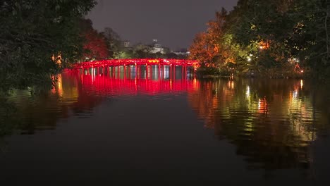 red bridge at night - the huc bridge over hoan kiem lake, hanoi, vietnam