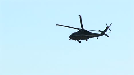 a military helicopter flies over washington dc