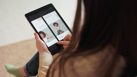 Back-view-of-a-girl-using-a-tablet