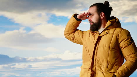 male explorer standing at a scenic viewpoint appreciating the peaceful beauty