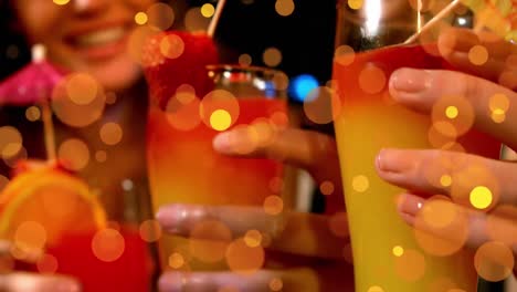 Animation-of-spots-of-light-over-couple-with-drinks