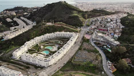 Aerial-orbit-over-large-new-housing-complex-on-the-outskirts-of-Malaga,-southern-Spain