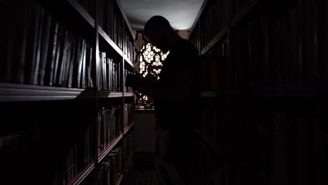 a young man reading a book inside al qaraouiyine university