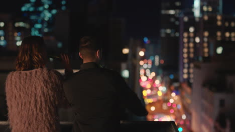 happy-caucasian-couple-chatting-enjoying-rooftop-view-of-city-sharing-connection-drinking-alcohol-hanging-out-on-weekend-date