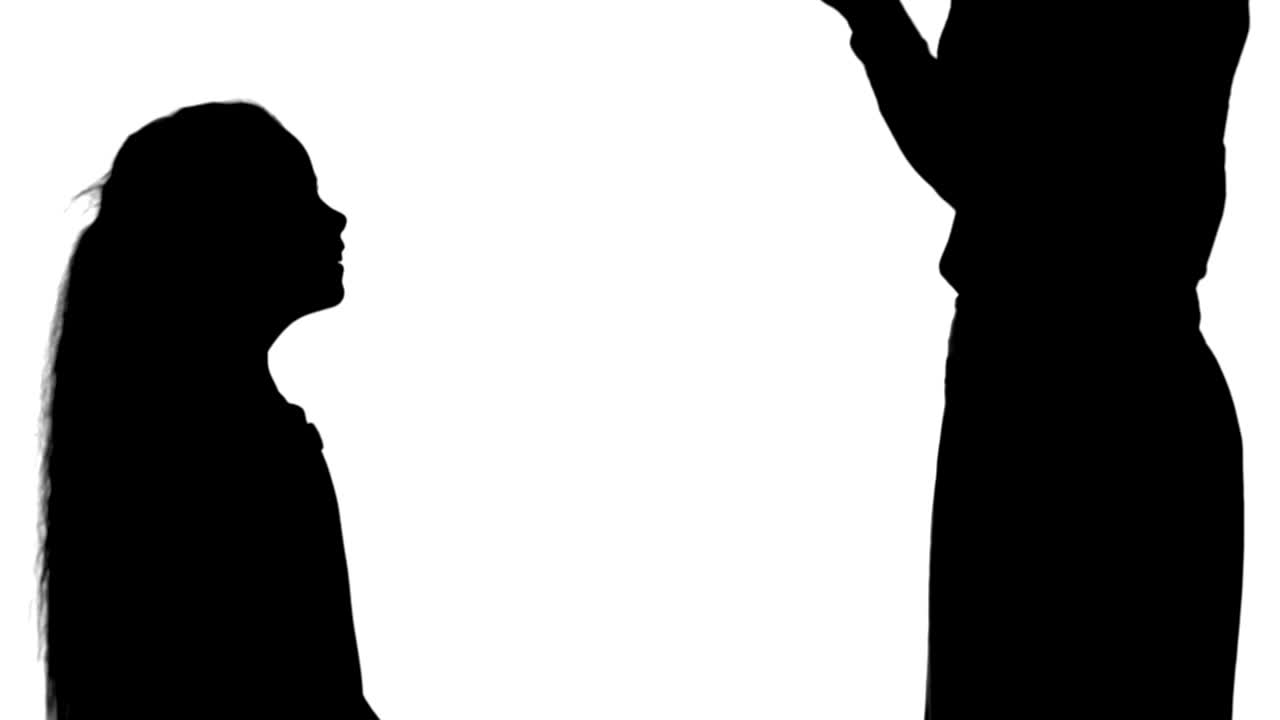 Silhouette Little girl giving a gift to her mother and kissing track matte