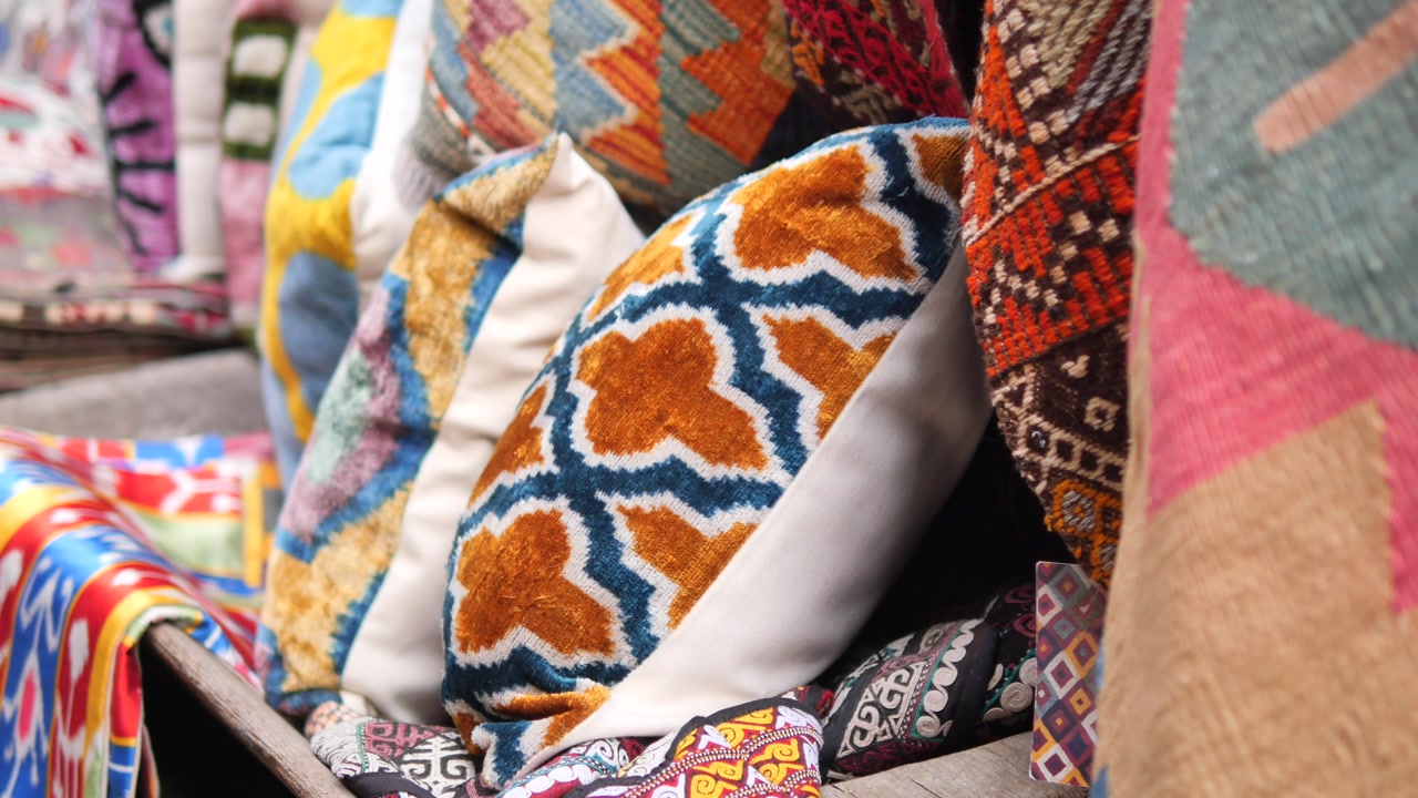 Close-up of Colorful Ethnic Patterned Pillows and Textiles