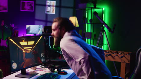 man starting gaming session, using powerful computer to play game