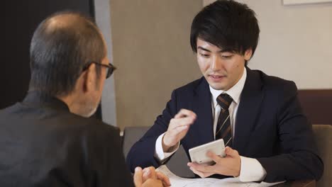 a sales man proposing a restaurant refurbishment plan