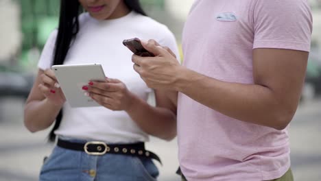 Cropped-shot-of-young-people-using-digital-devices