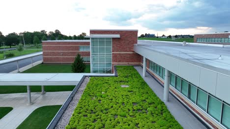 plants on green roof of futuristic school in usa