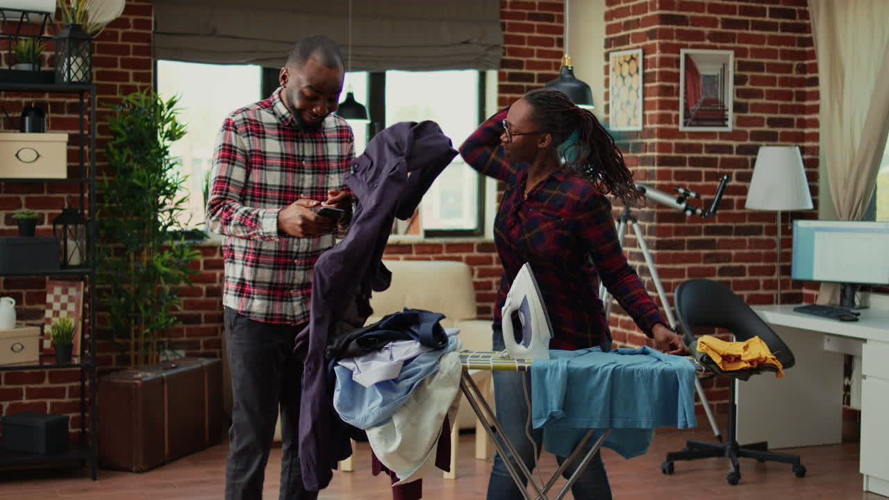 Stressed young person ironing laundered apparel