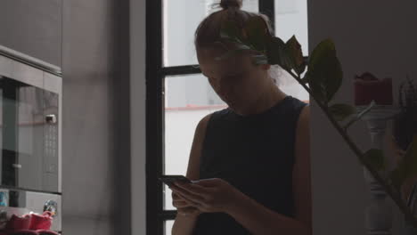 woman with frowning face texting on smartphone