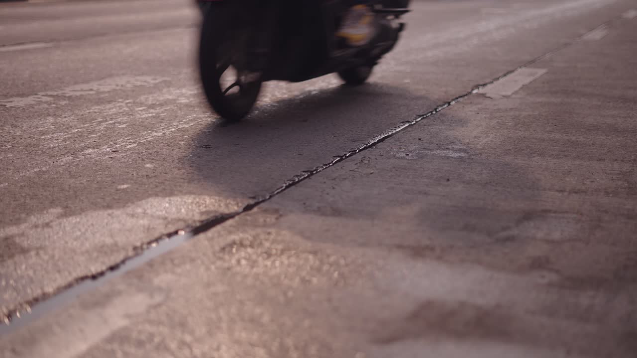 Close-up view of a road surface with a crack