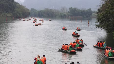 tourists rowing boats in a picturesque landscape