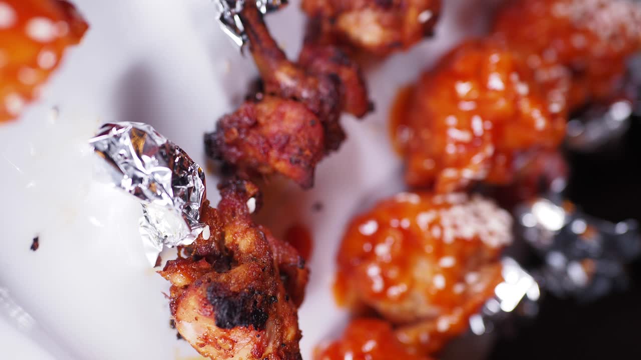 Close-up of Delicious Fried and Glazed Chicken Lollipops