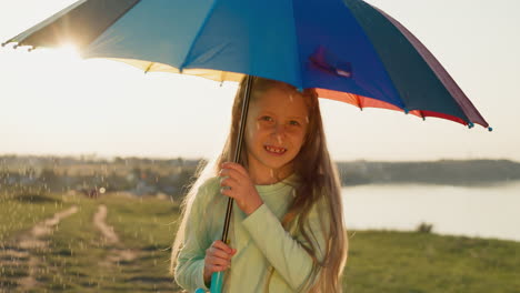 girl hides from rain under parasol in sunlight child transforms mundane rainy day in playful dance