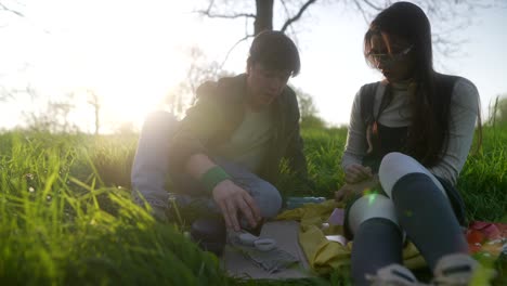 couple enjoying tea outdoors during sunset