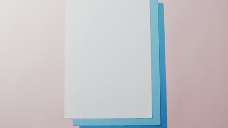 close up of blank card on white background with copy space in slow motion