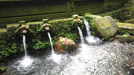 bali hindu water temple cascades and flower offerings at mengening tampaksiring purification ritual ancient site