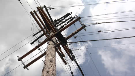 wires run to a power pole from four directions