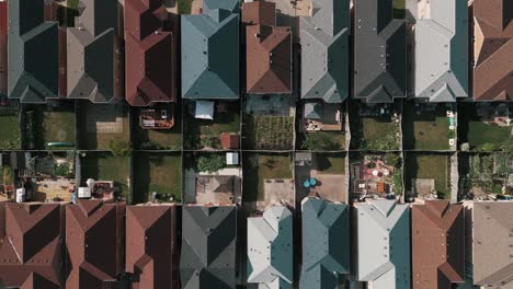 Top-down-aerial-drone-footage-of-colorful-suburban-homes